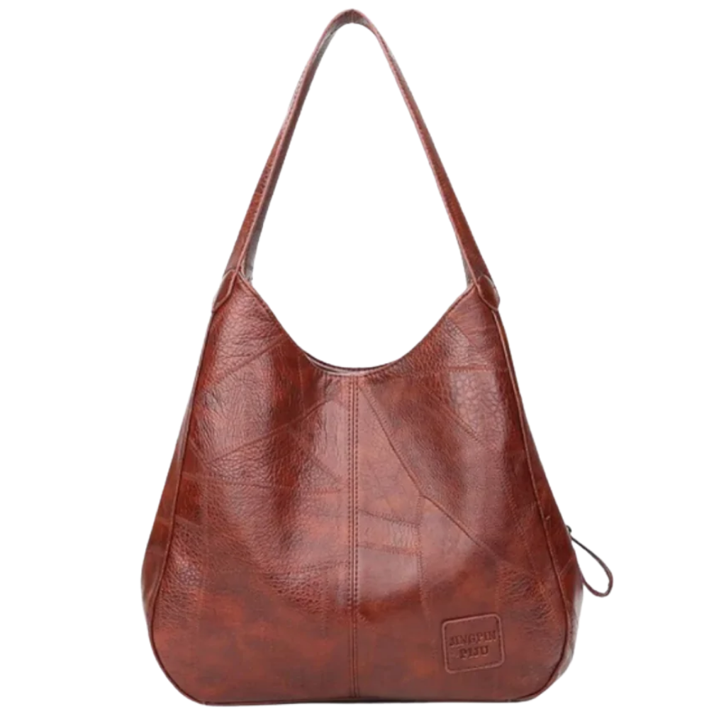 Bolsa shopping oversized marrom da marca Udiyo, sac à main de estilo clássico e amplo, com alça robusta e acabamento elegante.