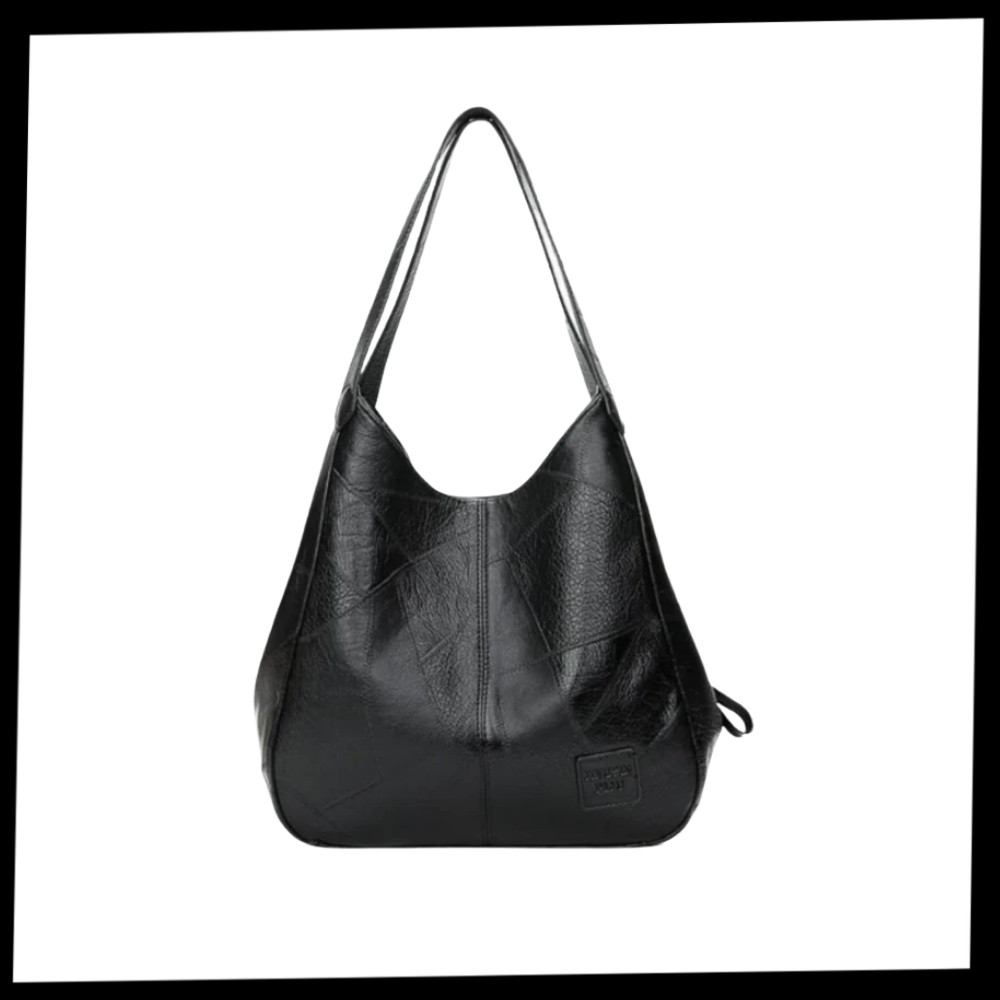 Sac à main oversize clássica da Udiyo, bolsa grande de ombro com design elegante e espaço amplo, mostrada na imagem.