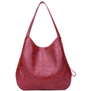Sac à main oversize clássico da Udiyo, em vermelho, com alça larga e design elegante, adequado para looks sofisticados.
