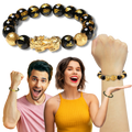 Pulseira de obsidiana preta e detalhes dourados da marca I-Mart, feita de contas de pedra com acabamento elegante.