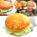 Almofada em forma de hambúrguer para sofá ou cadeira, da marca Genuiskids, com detalhes coloridos de queijo, alface e carne.
