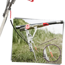 Suporte de canne de pêche Huitaisann com mola para fixar varas de pesca, vermelho, em uso ao lado de uma caixa de pesca.