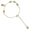 Pulseira de jade de Hetian com sinos, feita pela marca Falx, exibida em close com detalhes do material e acabamento.