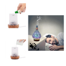 Difusor de óleos essenciais em forma de vaso com padrão de fogos de artifício, para aromatização de ambientes.