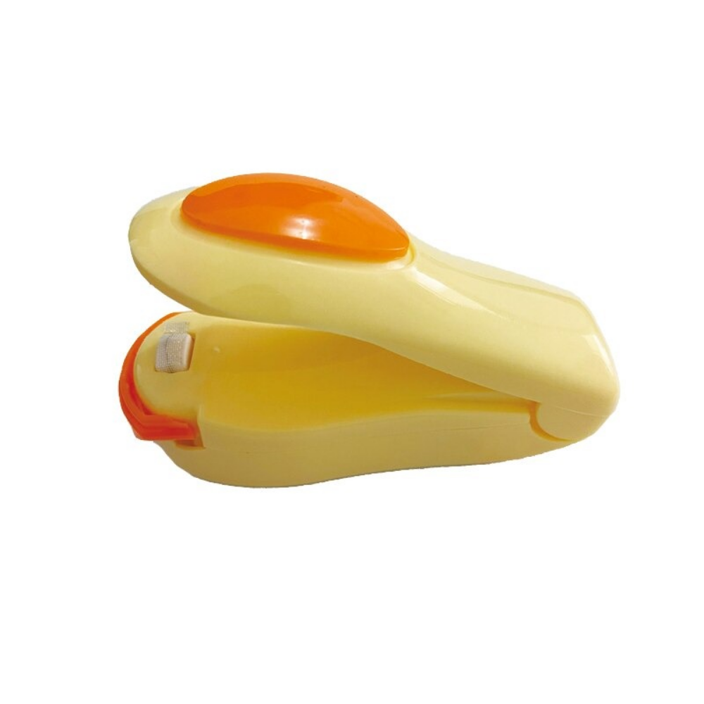 Máquina de selar portátil da Ozerty France, acessório de pequeno eletrodoméstico na cor bege para vedar alimentos.