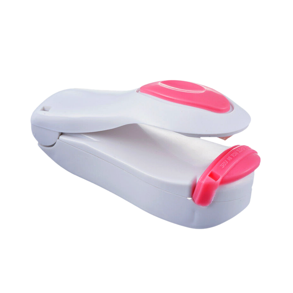 Máquina de vedação portátil da Ozerty França, pequena e branca, ideal para selar alimentos na cozinha.