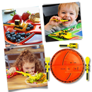 Conjunto de pratos e utensílios de cozinha criativos da marca Constructive Eating, com pratos coloridos e utensílios de uso diário.