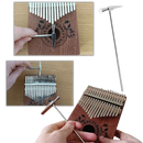 Kalimba Dido de 17 teclas, instrumento de música de dedo, com acabamento azul e detalhes visíveis na imagem.