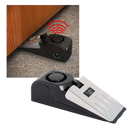 Alarme de segurança com cale-porte Febmiss, peça de quincaillerie para portas, visível na imagem com dispositivo preto e suporte.