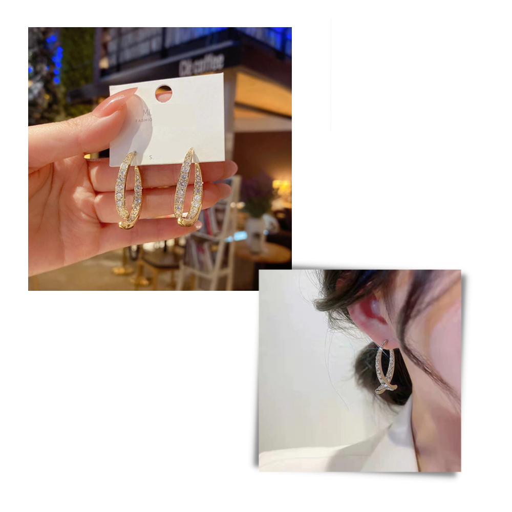 Boucles d'oreilles Helevia en forme courbe croisée, finition dorée et argentée, élégantes et modernes, pour un look sophistiqué.