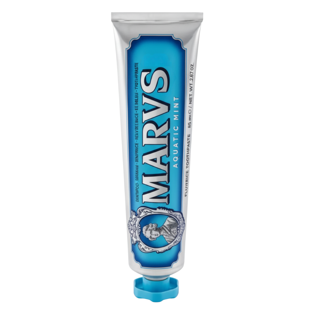 Dentifrício branqueador de menta da marca Marvis, cuidados bucais com tubo roxo e embalagem elegante.
