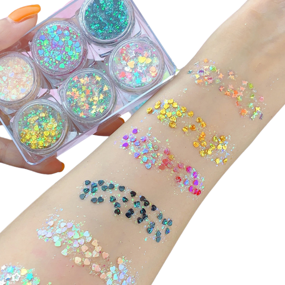 Conjunto de paillettes para rosto e corpo da marca Nyxberryt, com brilho prateado e detalhes coloridos para maquiagem e decoração.