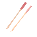 Escova de pés com cerdas macias da marca Homyl para cuidado dos pés, na cor rosa.