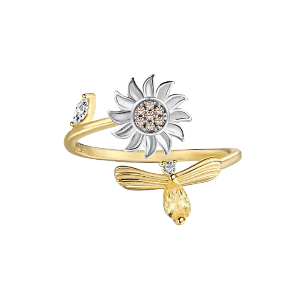 Anel de ouro com flor de girassol giratória da marca Helevia, detalhes delicados e design elegante.