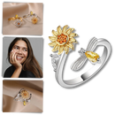 Anel giratório de girassol da marca Helevia, com design de flor de girassol e acabamento detalhado em metal.