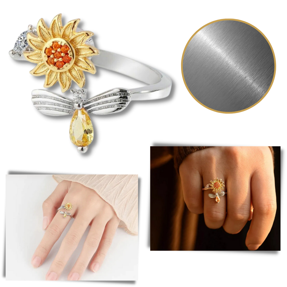 Anel de prata dourada com girador de girassol da marca Helevia, detalhe de anel com flor de girassol em movimento.