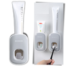 Distributeur de dentifrice mural Yrtoes para cuidados bucais, design preto compacto, fácil de usar e instalar na parede.